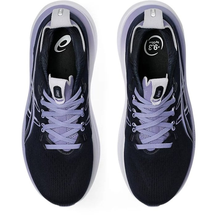 Black running shoes with purple laces on a white background