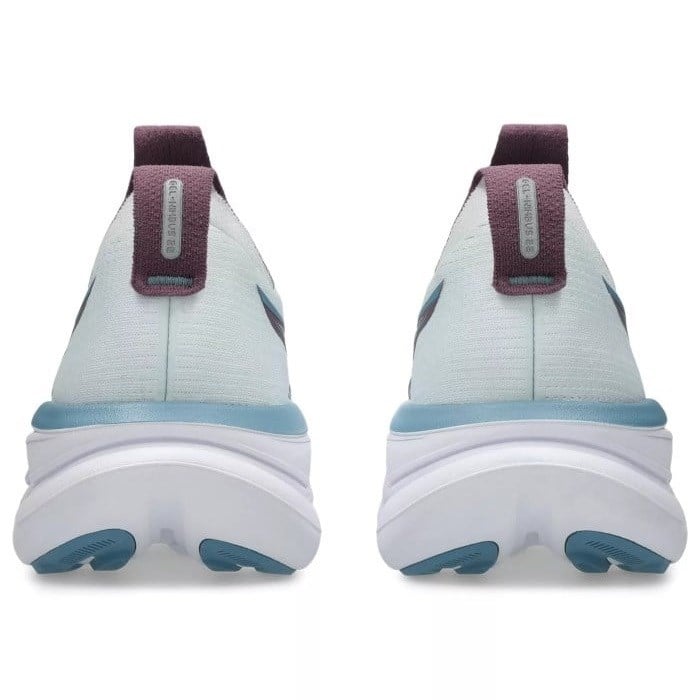 White sneakers with blue soles and purple straps on a white background