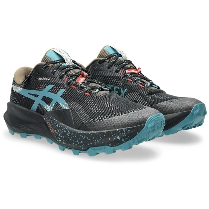 Black and blue trail running shoes on a white background