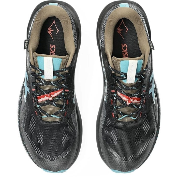 Pair of black athletic shoes with blue accents on a white background