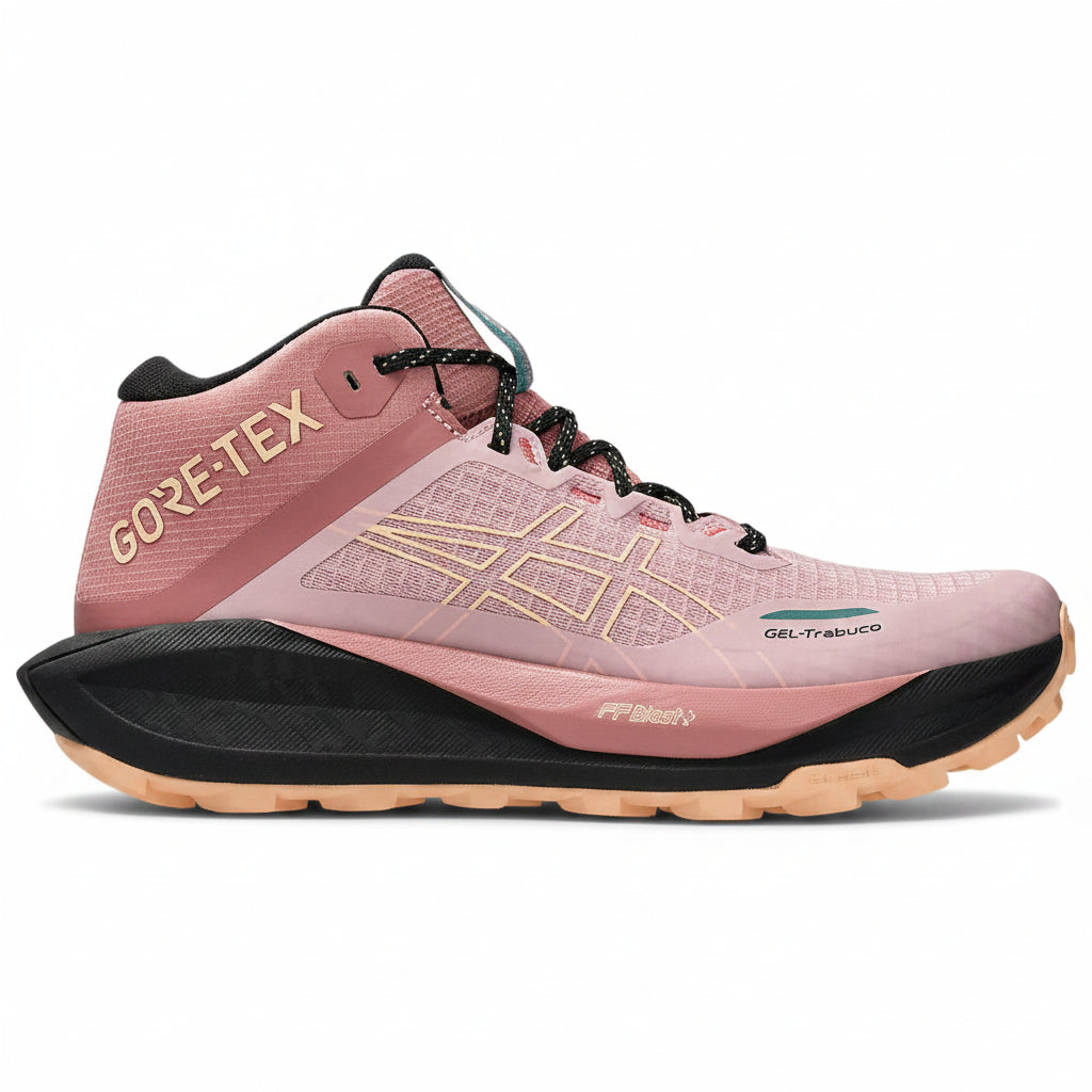 Pink hiking shoe with black sole on a white background