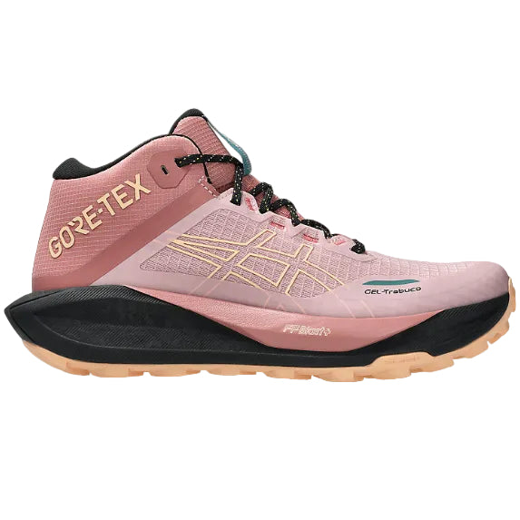 Pink hiking shoe with black sole on a white background