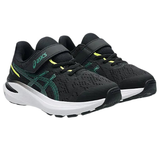 Pair of black and green running shoes with white soles on a white background