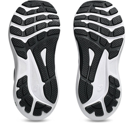 Close-up of the sole of a running shoe with black and white tread pattern on a white background