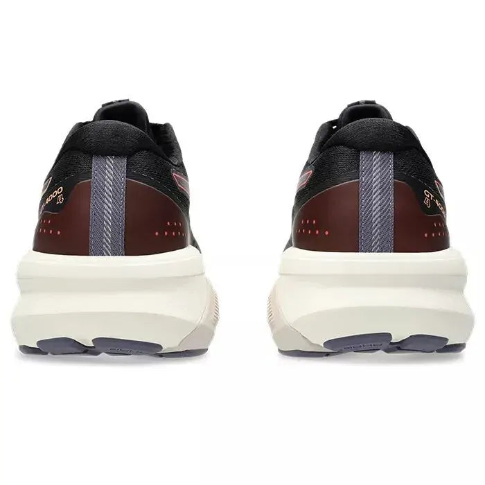 Black and brown sneakers with white soles on a white background