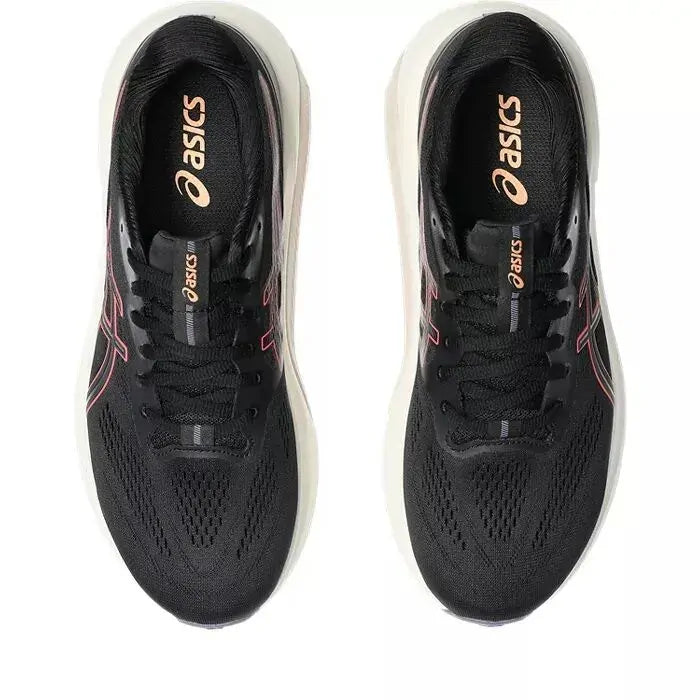Black running shoes with pink accents and Asics logo on a white background