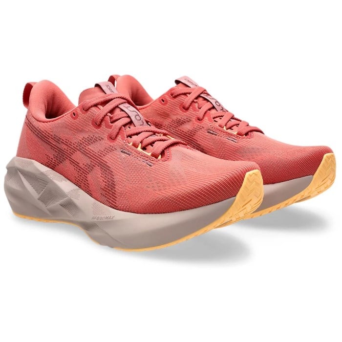 Red running shoes with a beige sole on a white background