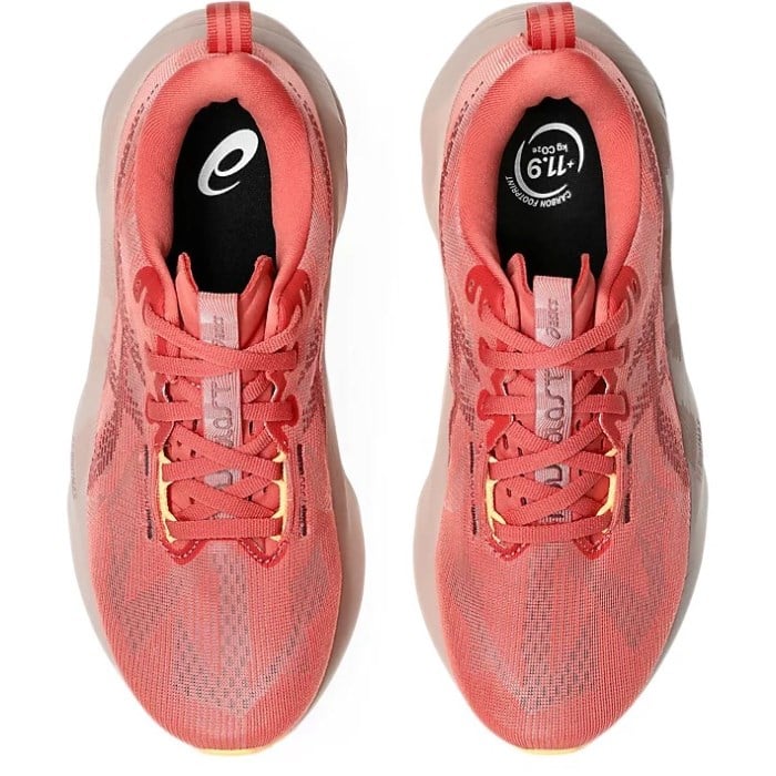 Pair of coral running shoes with visible brand logo on a white background