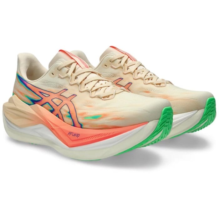 Beige running shoes with colorful accents on a white background