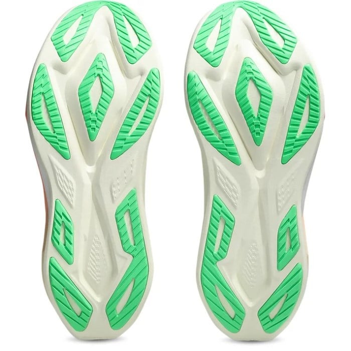 White and green athletic shoe sole on a white background
