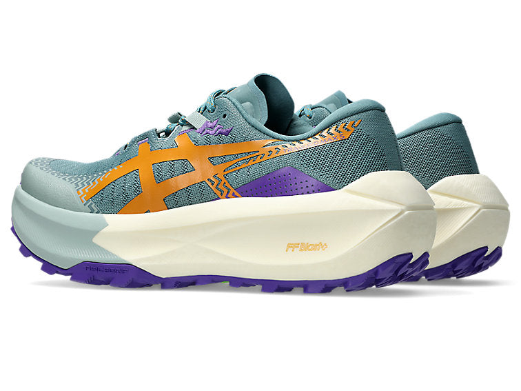 Blue and orange running shoe on a white background