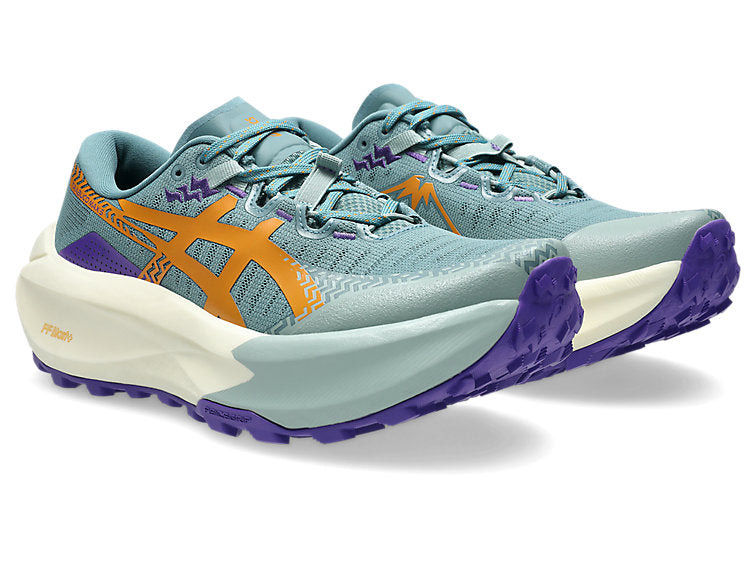 Pair of running shoes with a blue, purple, and orange design on a white background