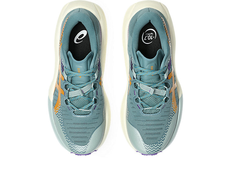 A pair of Asics running shoes in a dusty teal blue colorway with orange accents and a white midsole, shown from a top-down view on a white background.