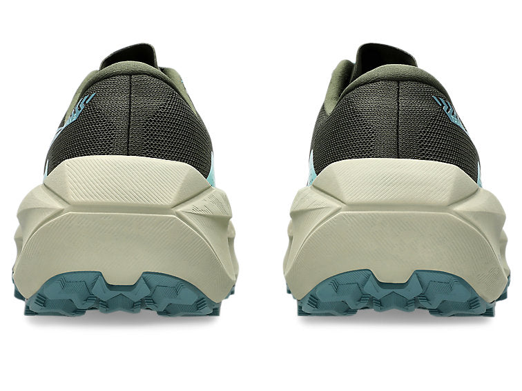 Black and beige running shoes with blue sole on a white background
