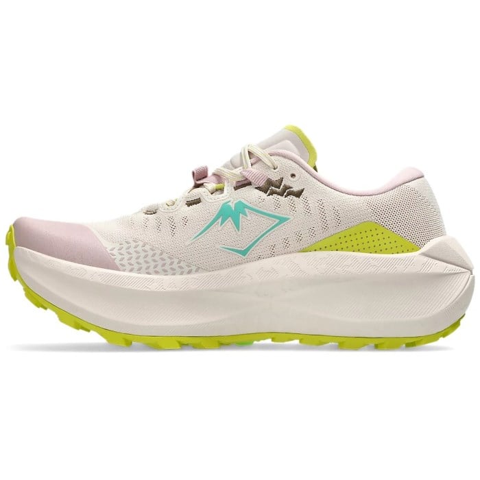 White running shoe with green sole on a white background