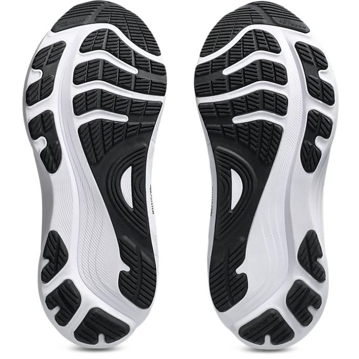 Close-up of black and white athletic shoe soles on a white background