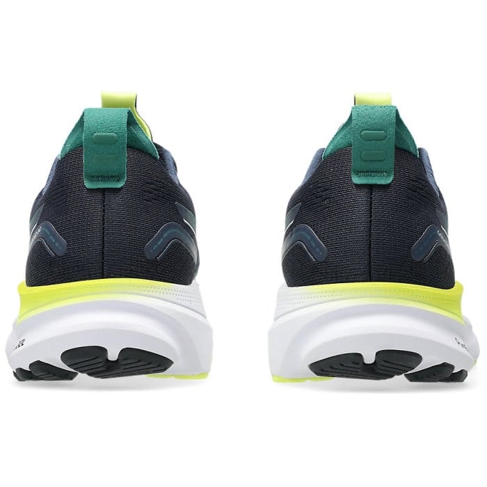 Back view of black running shoes with green and yellow accents on a white background