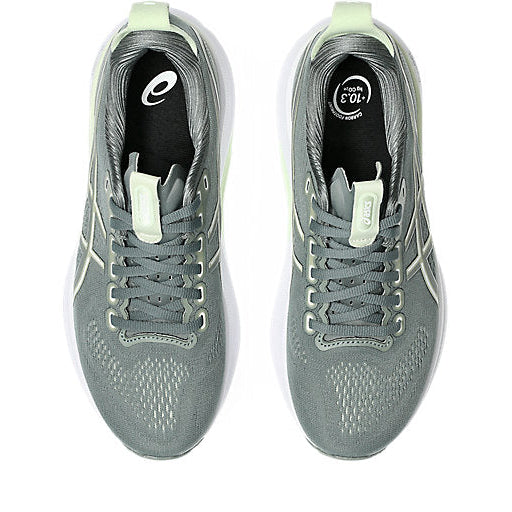 Gray running shoes with white soles on a white background