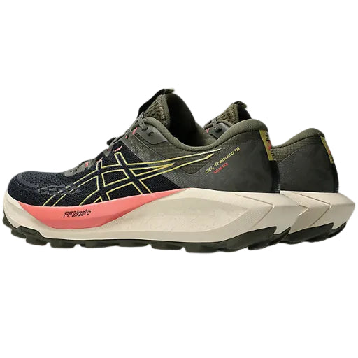 Trail running shoe with black, yellow, and red design on a white background