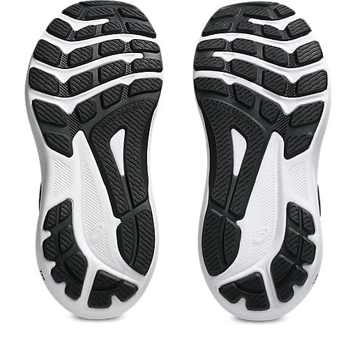 Close-up of black and white athletic shoe soles on a white background
