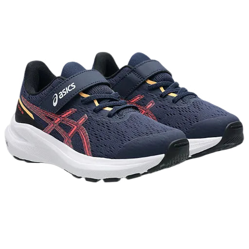 Navy running shoes with red accents and white soles on a white background