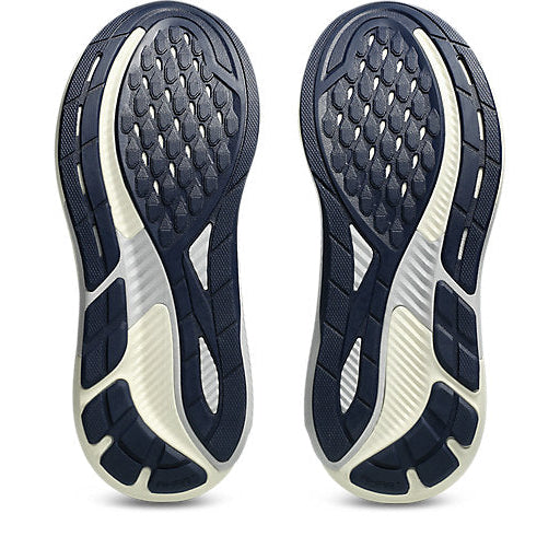 Navy and white athletic shoe sole on a white background