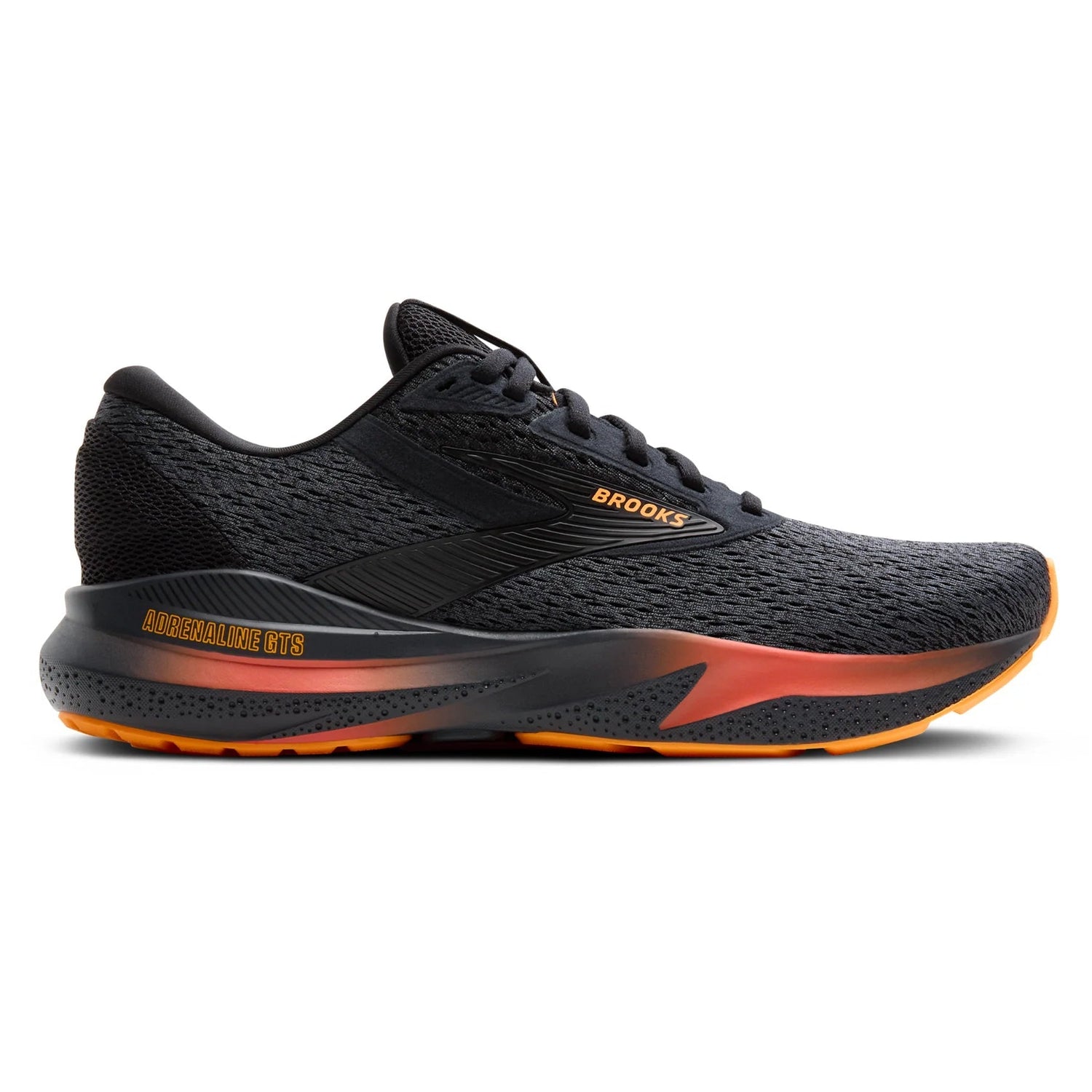 Black running shoe with orange sole on a white background