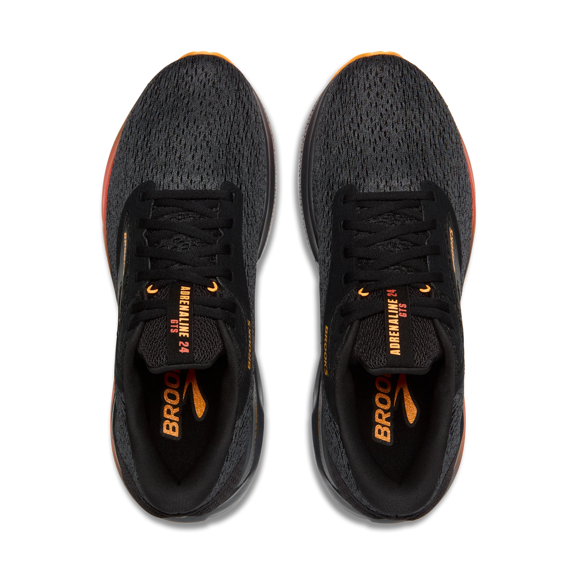Black running shoes with orange accents on a white background