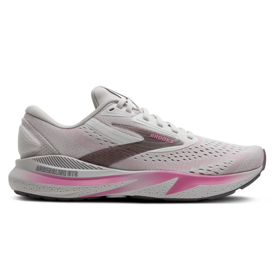 White and pink running shoe with 'Brooks' branding on a white background