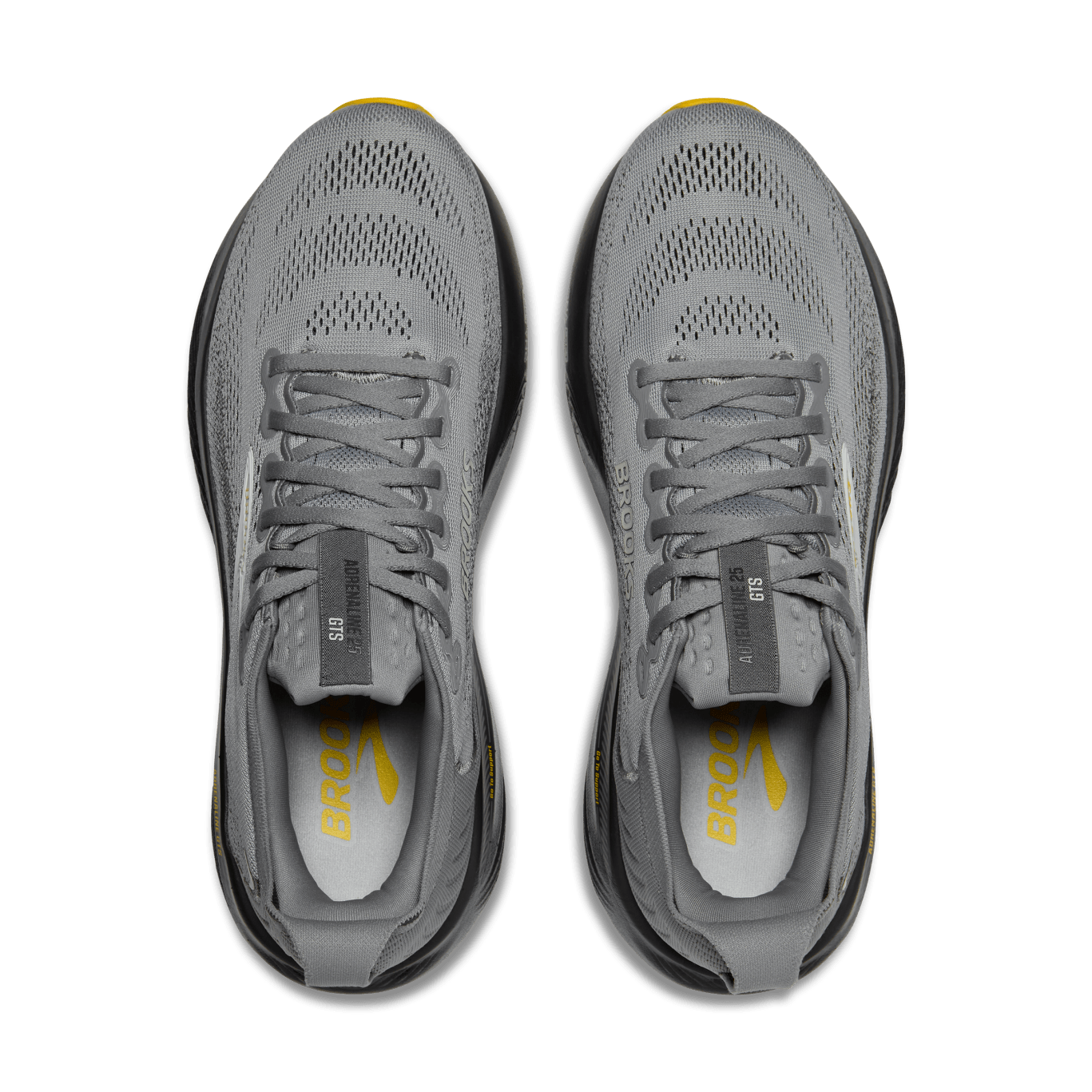 Gray running shoes with yellow accents on a transparent background