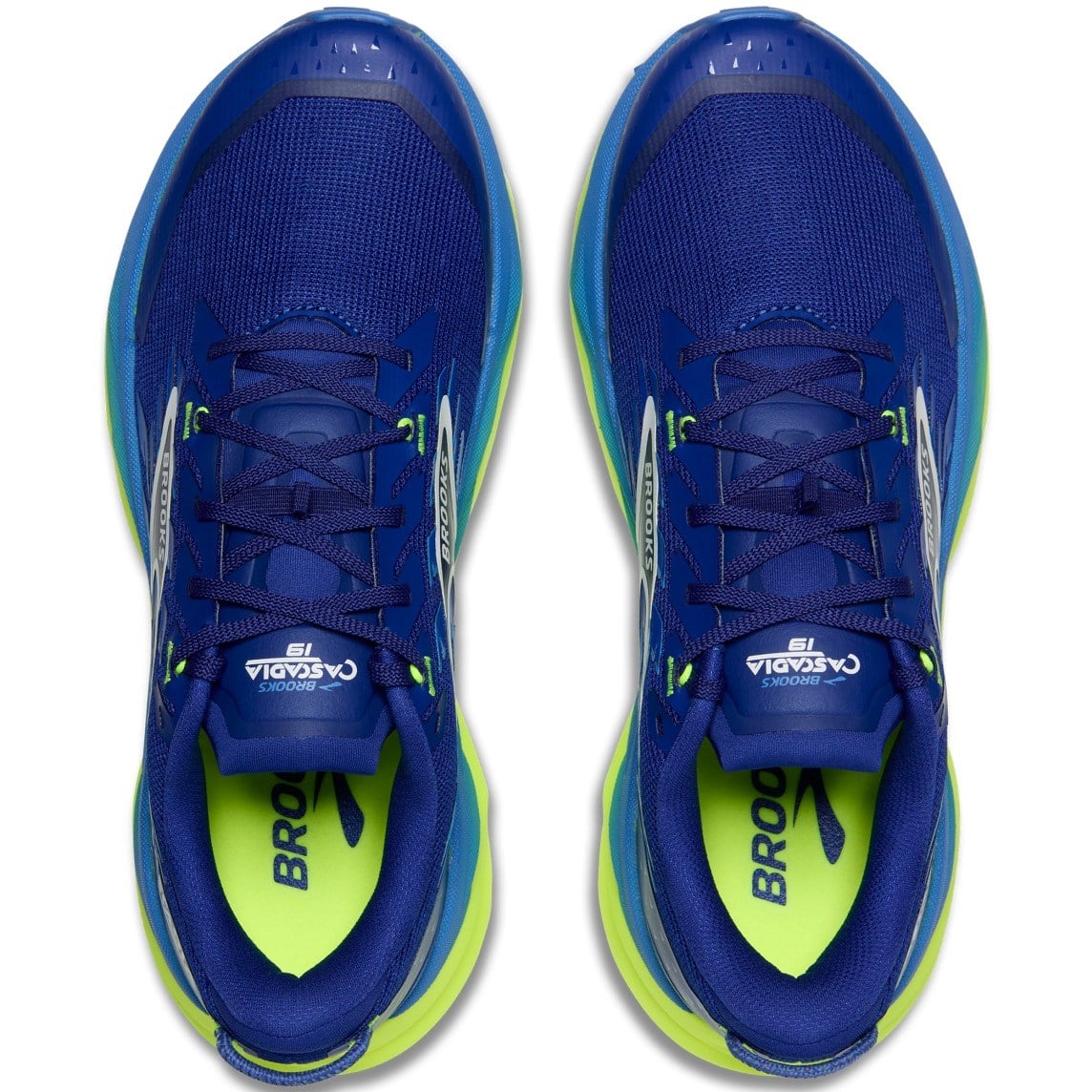 Pair of blue running shoes with green accents on a white background