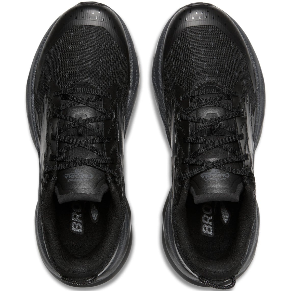 Black athletic shoes with 'Brooks' branding on a white background