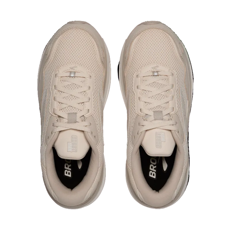 Pair of beige sneakers with black soles on a transparent background