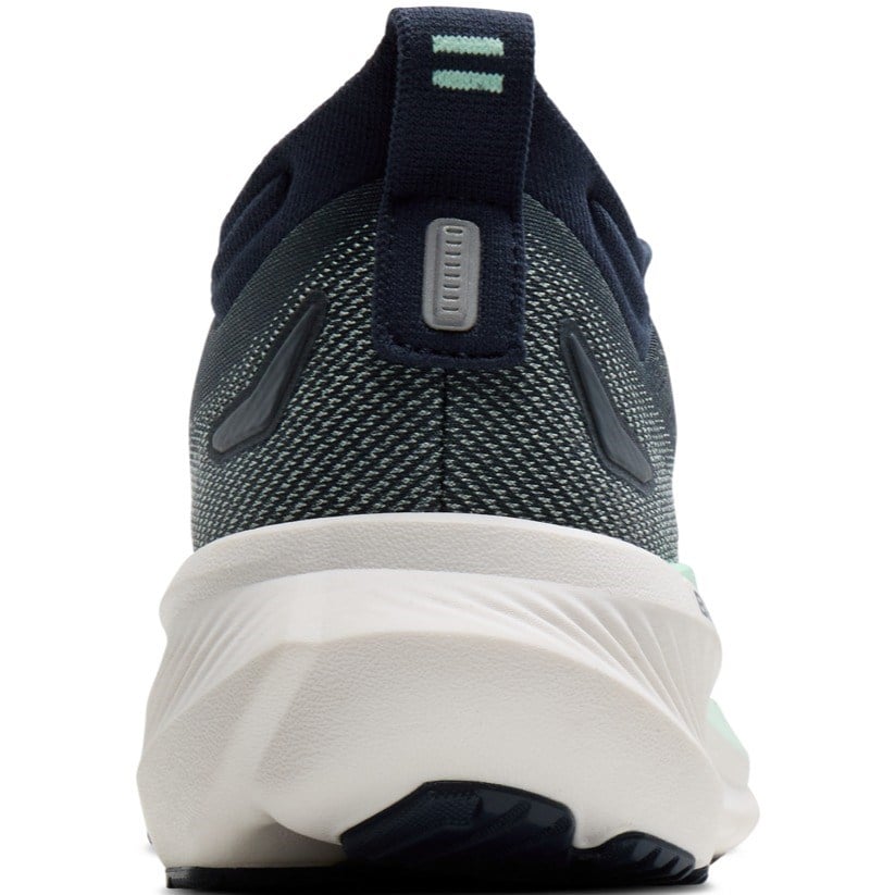 Navy running shoe with white sole on a white background