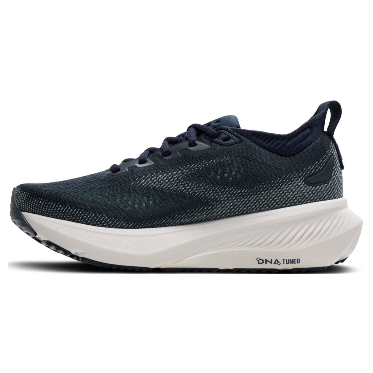 Navy running shoe with white sole on a white background