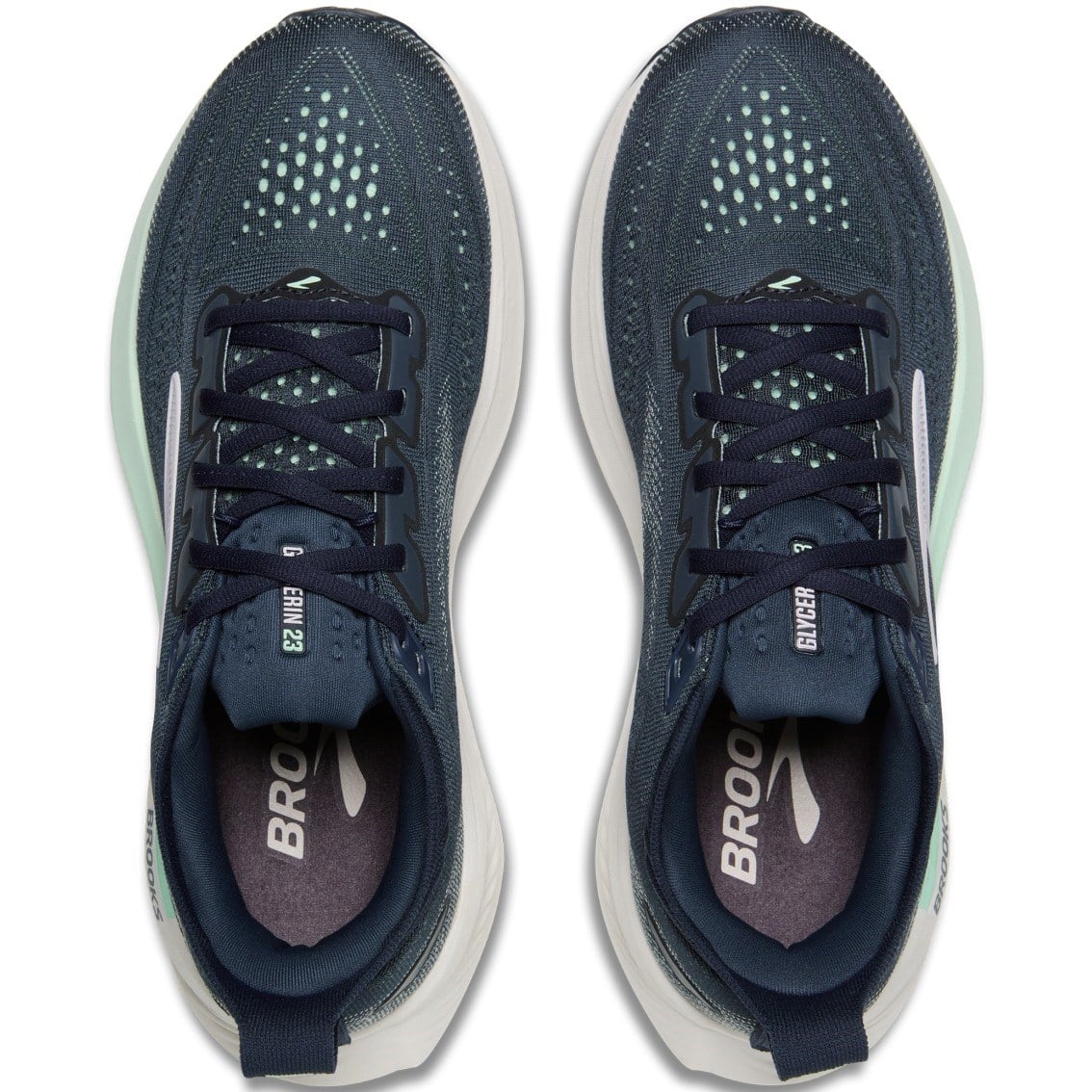 Pair of blue running shoes with white soles on a white background