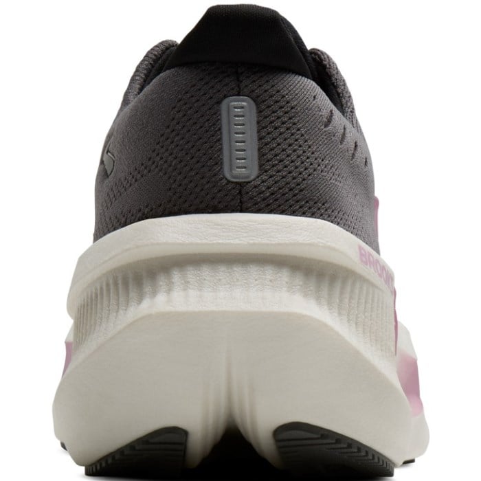 Back view of a running shoe with a white sole and black and pink side panels on a white background.