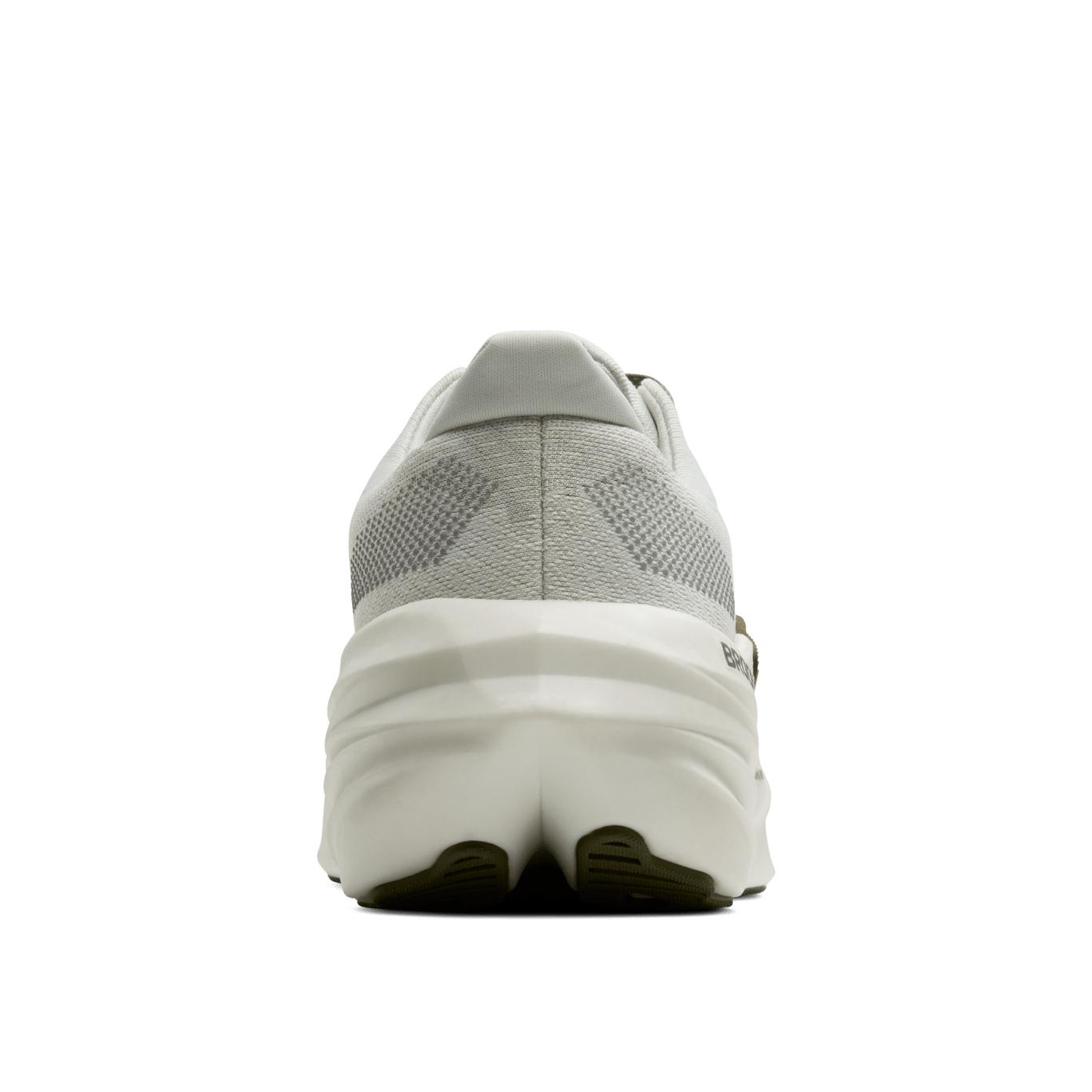 Gray running shoe with white sole on a green background