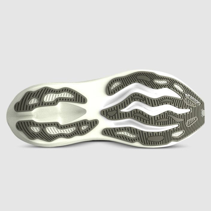 Close-up of a shoe sole with unique tread pattern on a light gray background