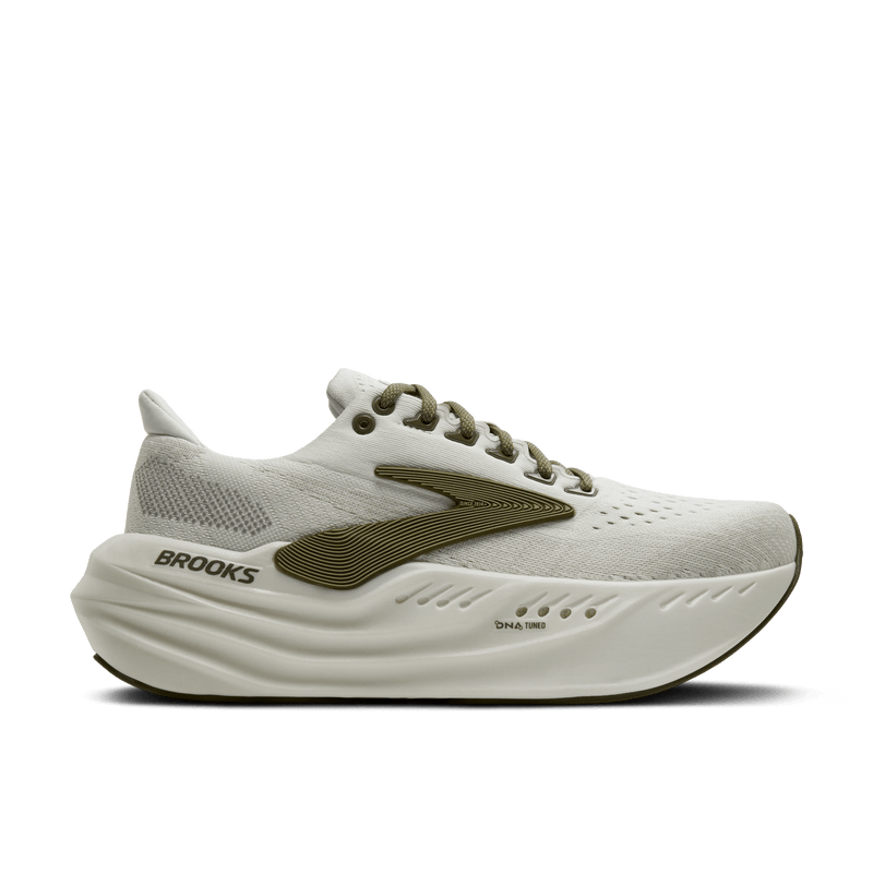 White running shoe with green accents on a transparent background