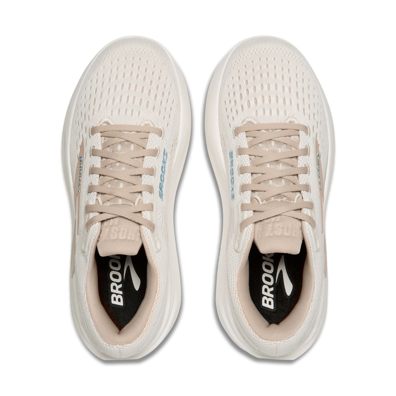 Pair of beige running shoes with black soles on a transparent background