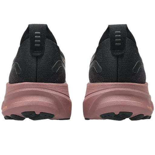 Black and pink running shoes shown from the back on a white background