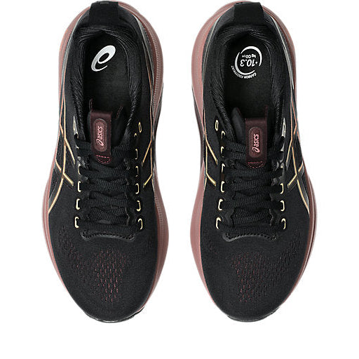 Black running shoes with gold accents on a white background