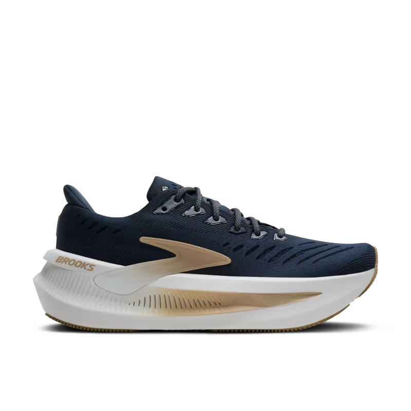 Navy running shoe with white sole on a transparent background