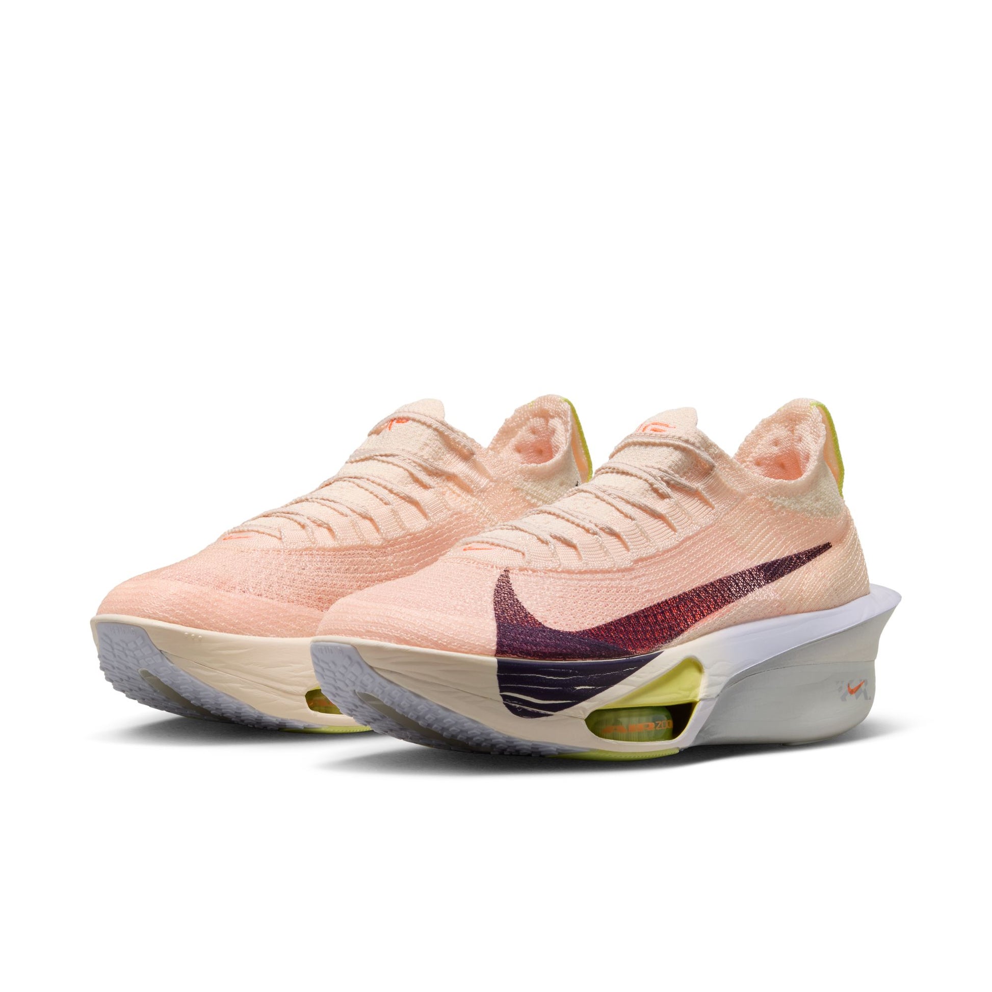 Pair of pink Nike running shoes on a white background