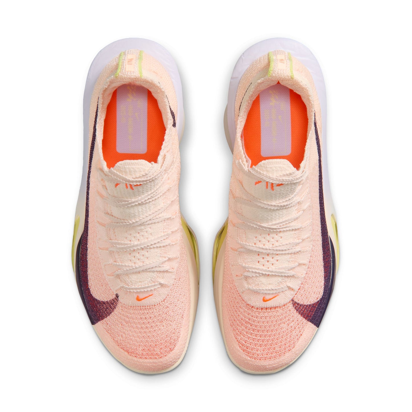 Pair of pink Nike running shoes with a white background
