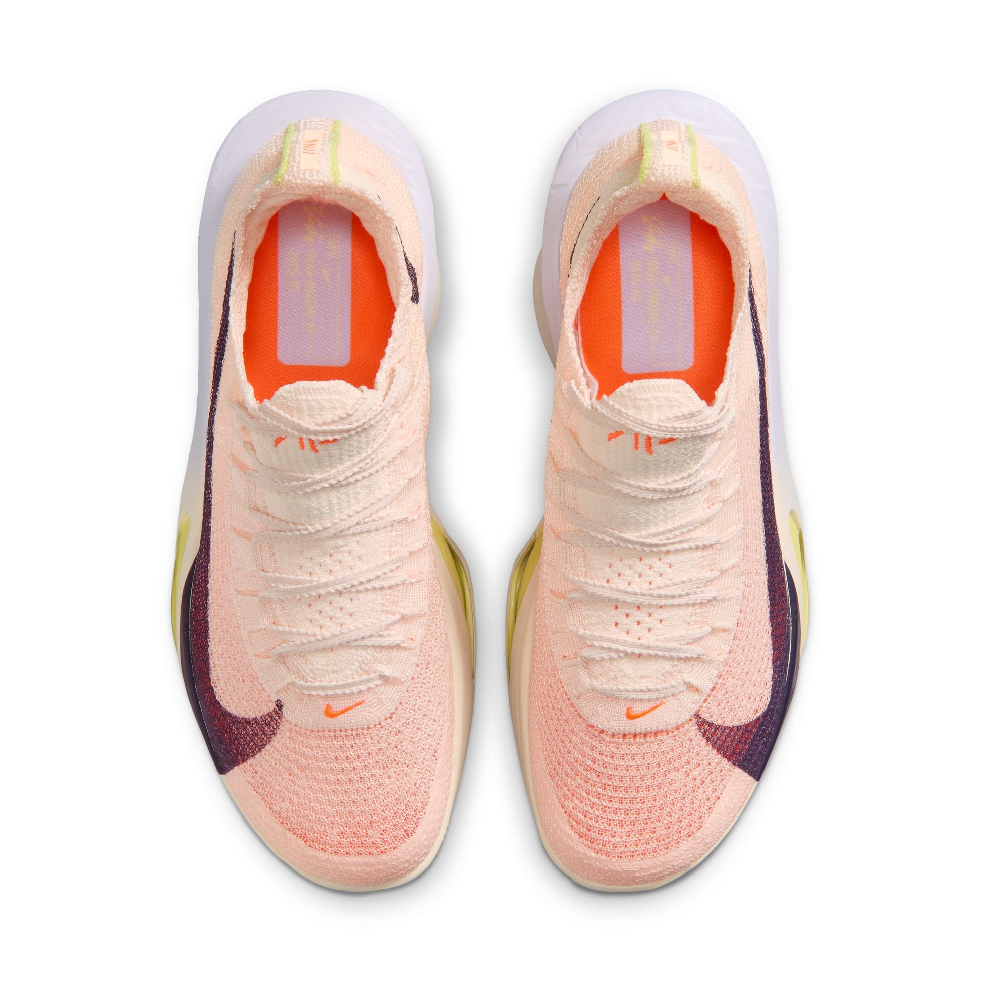 Pair of pink Nike running shoes with a white background