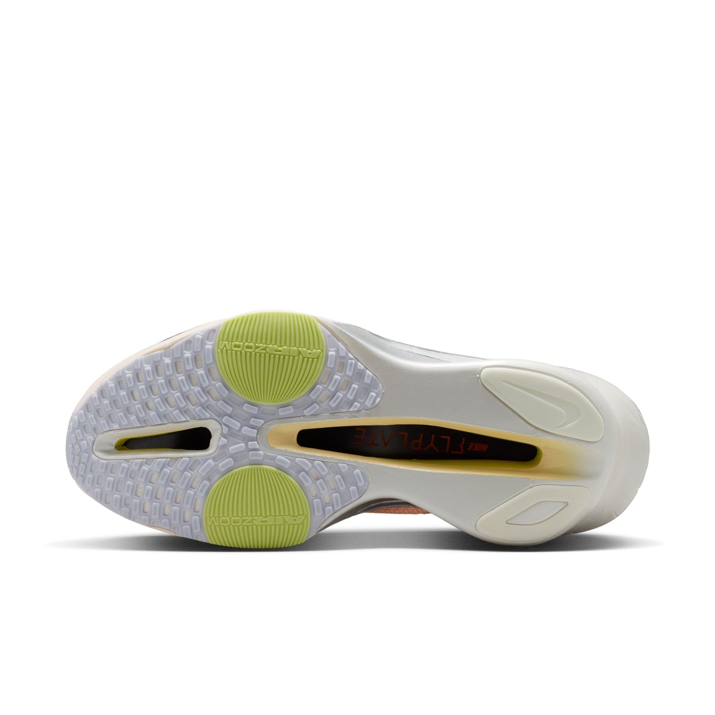 Sole of a sneaker with green accents on a white background