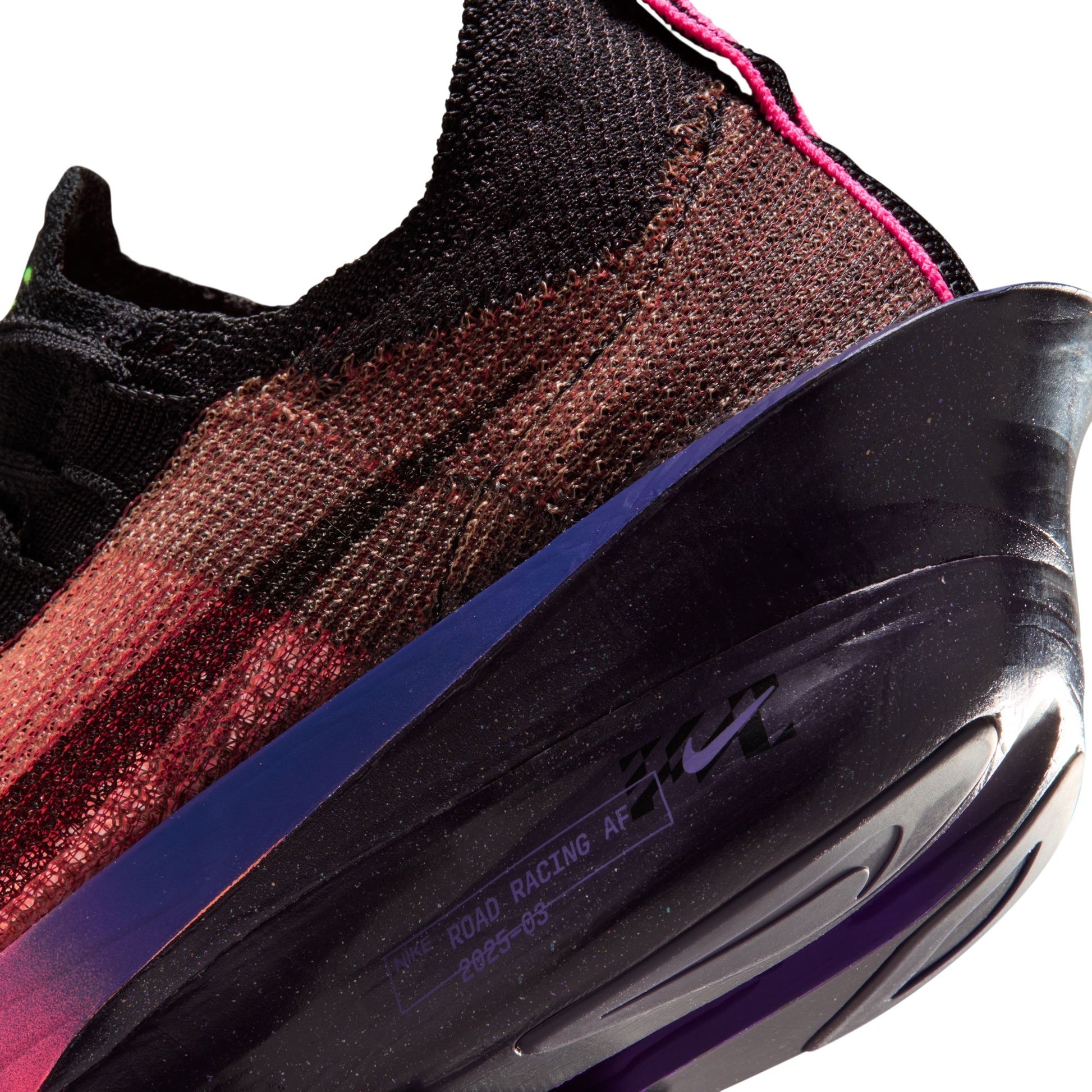 Close-up of a multicolored sneaker with a focus on the sole and brand logo.