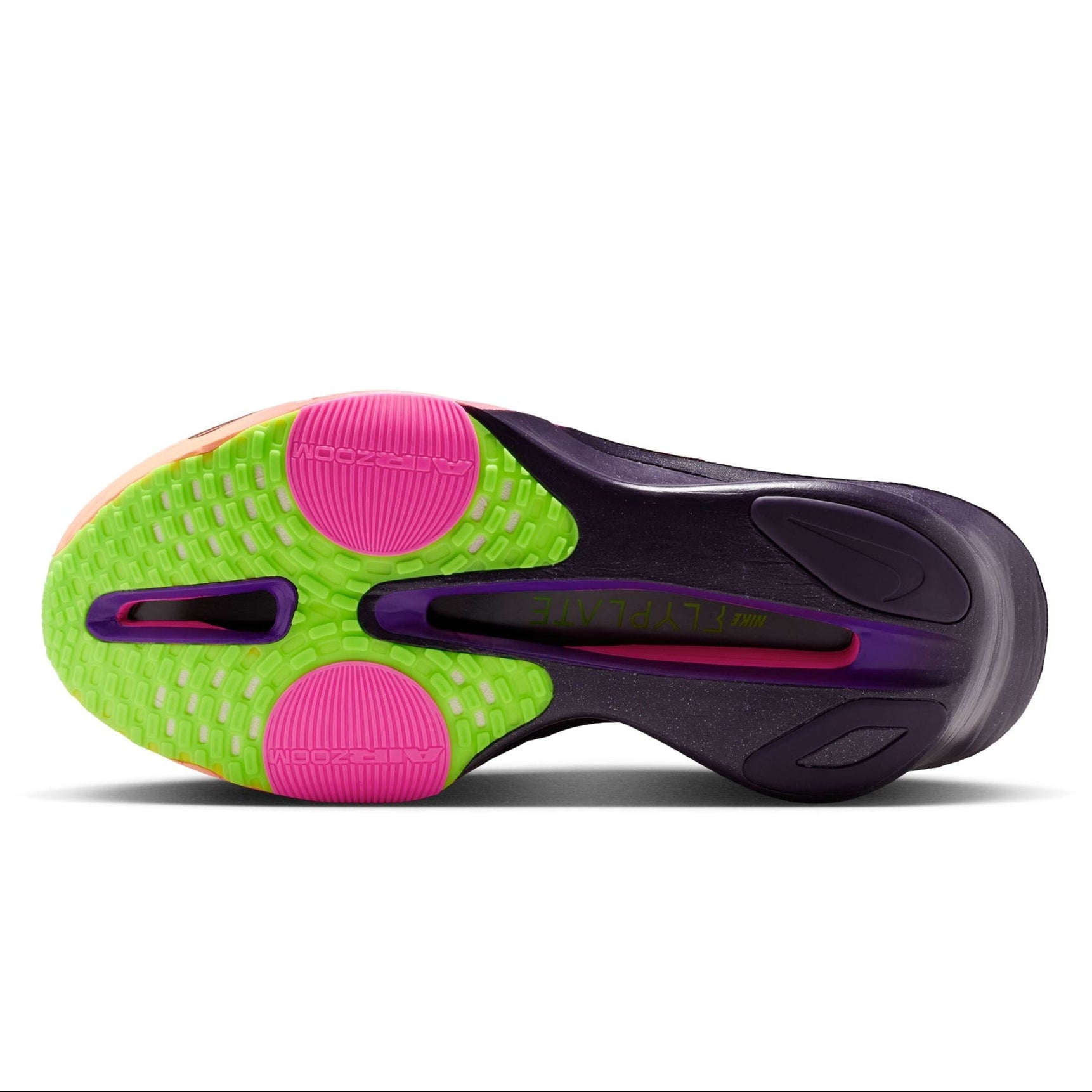 Close-up of a sports shoe sole with green, pink, and purple colors on a white background